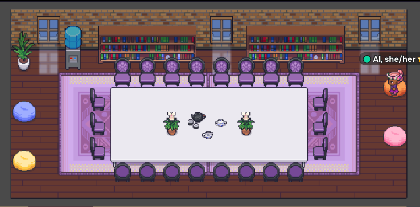 The Ginger room has a long purple rug and on top sits a 22 person white table with lavender chairs. three been bags are scattered around the rectangular room. Two brown book shelves are against the wall facing the viewer along with three pixelated windows with daylight. 