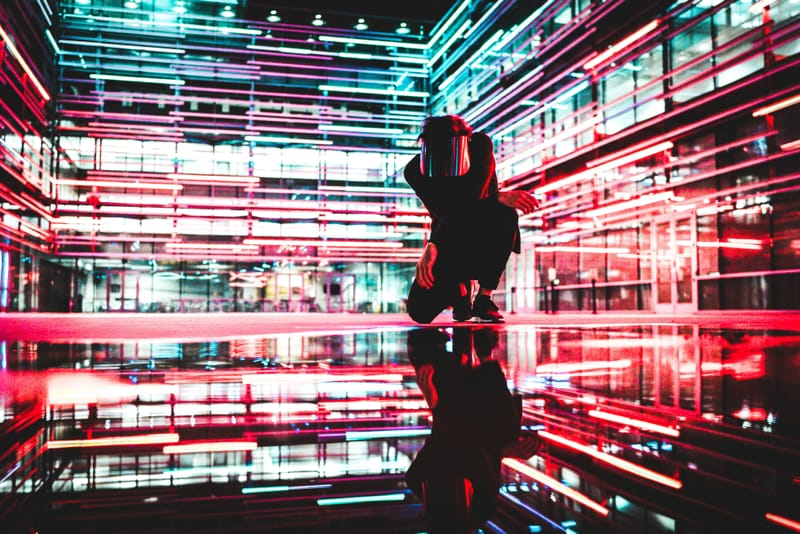 Flashy lights, reflective mirrors, and a person crouching 