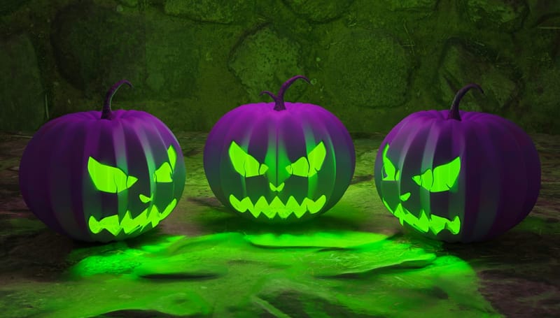 Three purple pumpkins emit an evil green scowling glow. 